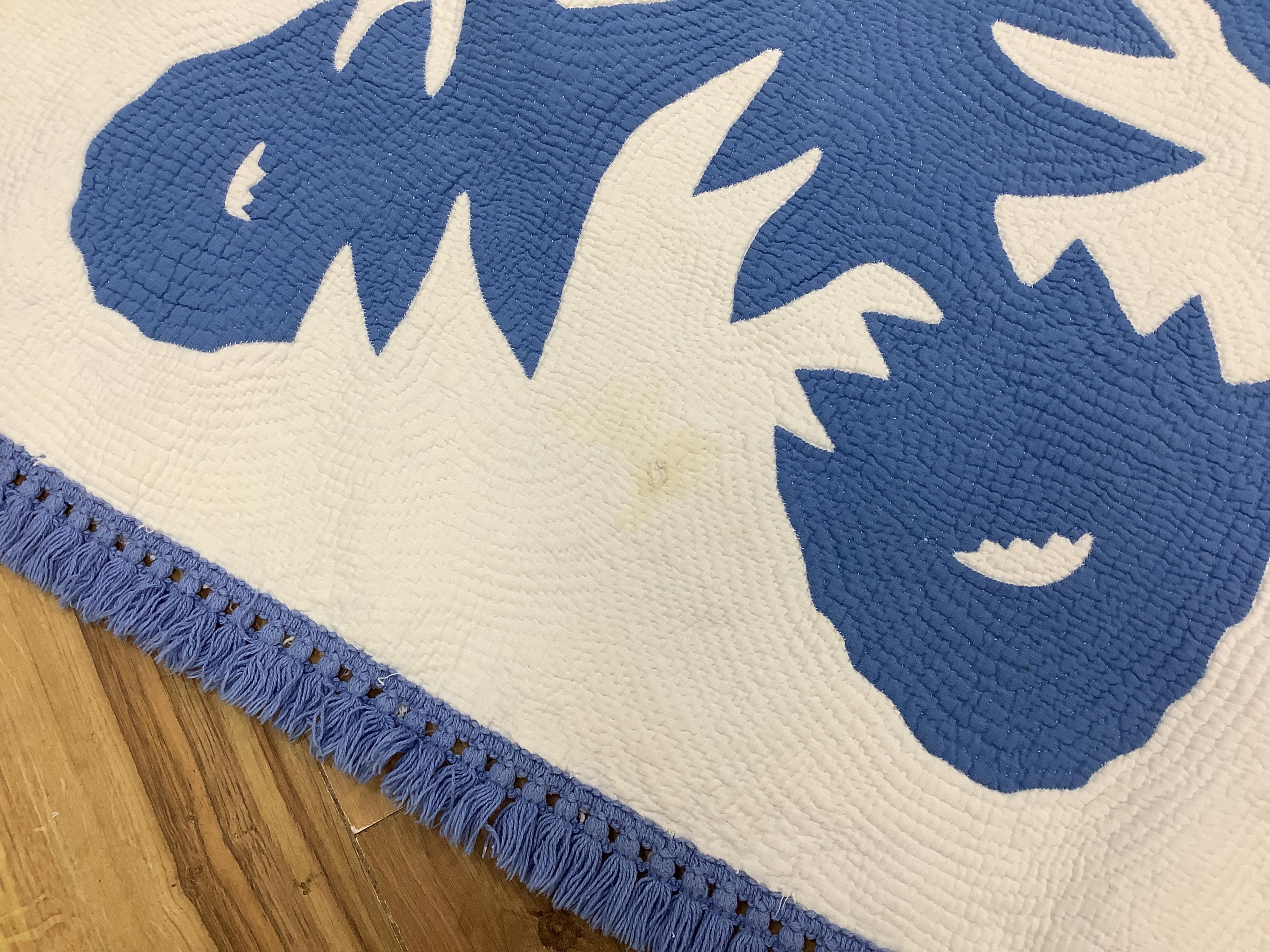 An American blue and white fringed bedcover (quilt)